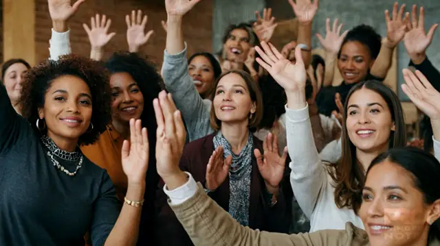 Diverse group engaged in dialogue, hands held high to signify unity, compassionate expressions of individuals from various backgrounds, inspiring images symbolizing social change and growth, vibrant community activity illustrating collaboration and empowerment